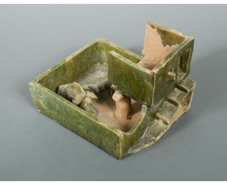 A Han dynasty green glazed farmyard, realistically modelled with a sow and her piglet confined in a pen, along with a ramp an