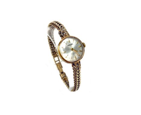 LADY'S RECORD NINE CARAT GOLD MANUAL WIND WRIST WATCH the round white dial with applied gold Arabic numerals, gold spade hand