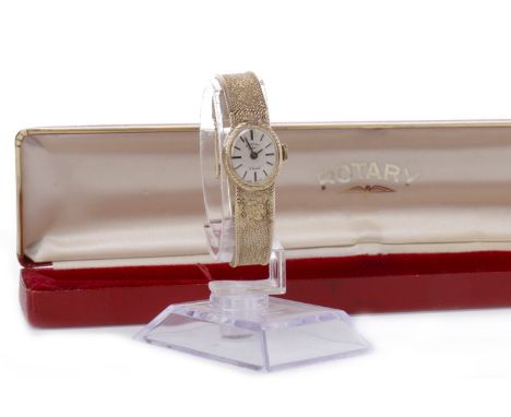 LADY'S ROTARY NINE CARAT GOLD MANUAL WIND WRIST WATCH the oval white dial with applied baton hour markers, 14mm case, on an i