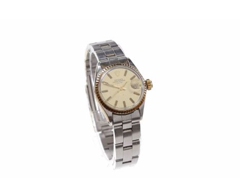 LADY'S ROLEX OYSTER PERPETUAL DATE STAINLESS STEEL AUTOMATIC WRIST WATCH the round cream dial with applied gold coloured bato
