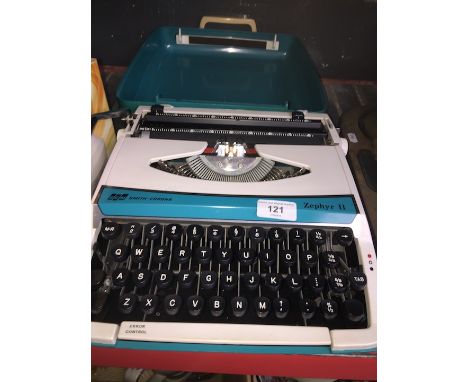 A vintage SCM Smith Corona Zephyr II typewriter in original case. 