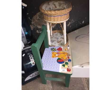 A childs chair and a vintage nursery storage piece 
