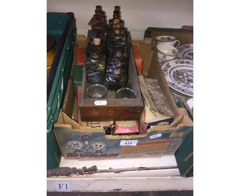 Box of vintage night lights and wooden drawer of bottles 