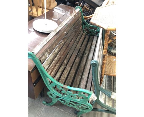 A garden bench with cast metal ends