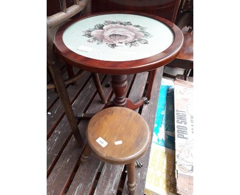 A small stool and a tripod table with tapestry top 