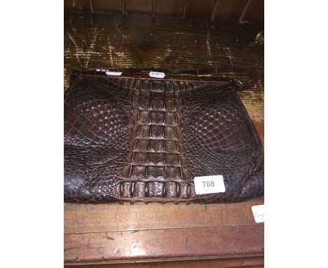 A vintage crocodile skin handbag 