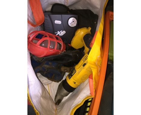A bag of tools and a bench vice 
