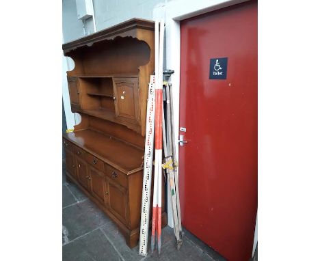 A surveyors tripod, scope and other measures 