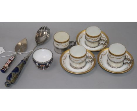 A part set of Paragon silver-mounted coffee cans and saucers, a Victorian silver-mounted trowel/slice and two other items, th