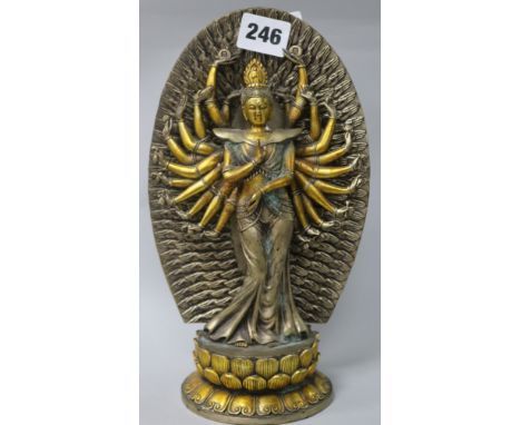 A south East asiain gilt bronze figure of a deity H.25cm