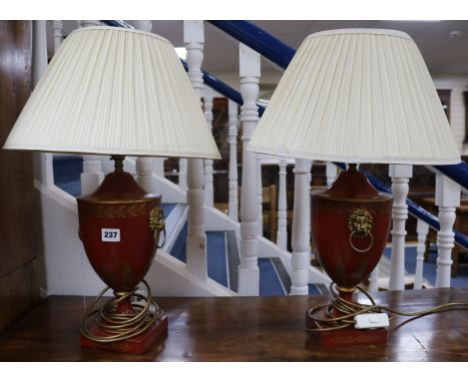 A pair of Regency style red and gilt lamp bases 38cm to fitting