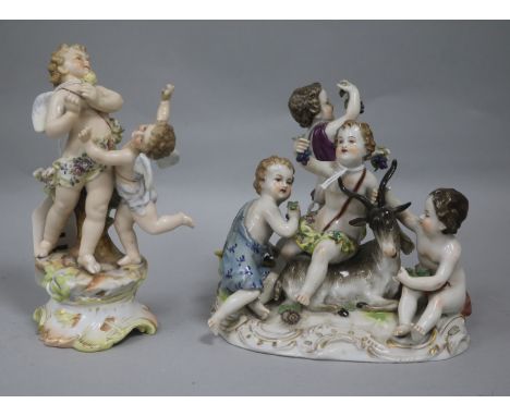 A Thuringian porcelain group of four bacchanal with goat and a Volkstedt group of two putti, each on naturalistic base, the b