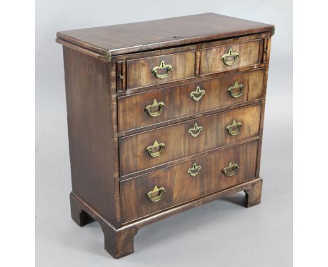 A George III mahogany bachelor's chest, with folding top over two short and three graduated long drawers, on bracket feet, W.