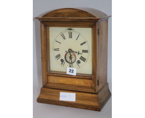 A walnut mantel clock H.30cm.