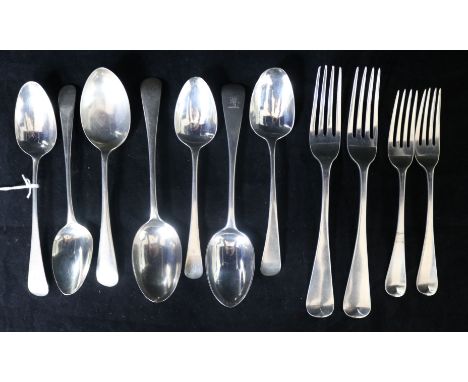 Seven assorted Georgian and later silver dessert spoons, a Georgian silver table fork and three Georgian silver dessert forks