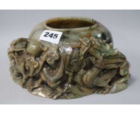 A Chinese green jade brushwasher W.20cm