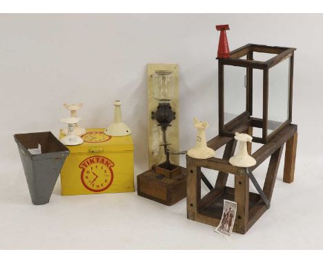 A collection of coffee-related items, a pine and cast iron coffee grinder, early 20th century,25cm wide25.5cm high,a coffee p