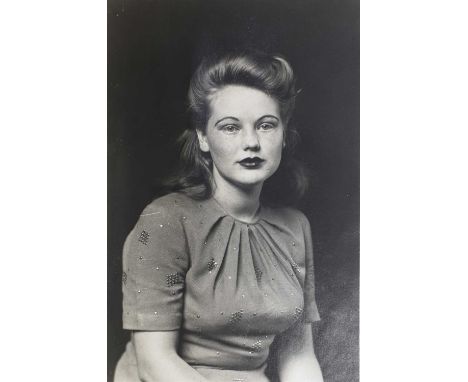 Mike Disfarmer (American, 1884-1959), 20th century, two photographic prints, one a studio portrait of a woman, and another of