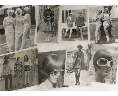 A collection of fashion photography, 20th century, comprising twenty-two silver gelatin print photographs of various fashion 