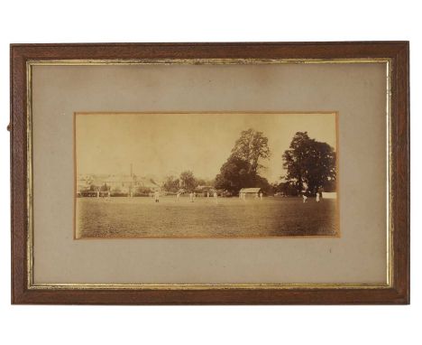 A photograph of a cricket match, c.1890, depicting a cricket match in Wimborne, Dorset,13.5 x 30cm