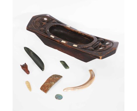 A collection of Inuit and Maori objects, 20th century, to include a carved wooden bowl with mother-of-pearl and bone inlay, a