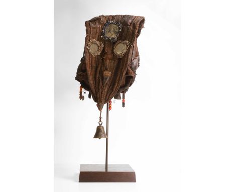 A Toma fetish sack, early 20th century, constructed from canvas, cloth, mirrors, horn, hair, beads and with a brass bell, mou