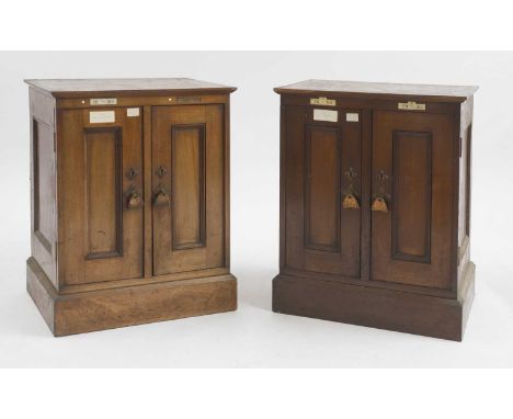 John Ruskin (1819-1900),  a pair of mahogany folio cabinets, 19th century, each moulded top with inlaid ivory labels, over a 