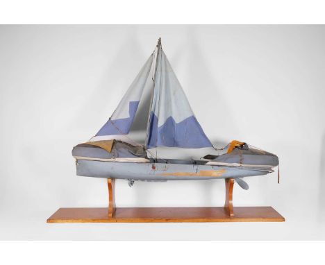 A model rescue boat, c.1940s, a prototype of a Second World War Uffa Fox model lifeboat, painted in blue and grey, with stitc
