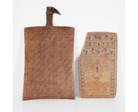 Two Islamic prayer boards, 19th century, one example with a bound handle, both with painted inscriptions,largest 54 x 29.5cm 