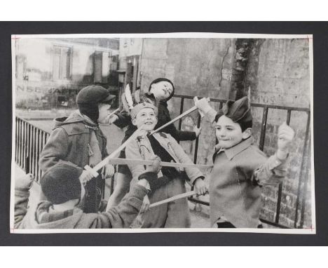 ▲ Henri Cartier-Bresson (French, 1908-2004) Boys sword fighting;Beach scenetwo photographic prints, 20th century, inscribed '