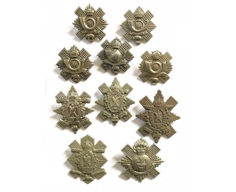 Scottish, Highland Light Infantry. 10 various glengarry badges.   QVC ... KC ... long ASSAYE ... blank scroll ... SOUTH AFRIC