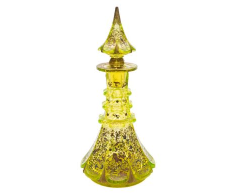 A Bohemian uranium glass decanter and stopper: of octagonal form with triple ringed neck and pointed stopper, decorated in en