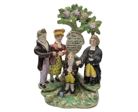 A Staffordshire pearlware 'New Marriage Act' group: of traditional form, the bocage tree trunk applied with a plaque inscribe