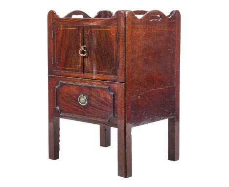 A George III mahogany and inlaid tray top commode:, the shaped gallery with carrying handles, the front enclosed by a pair of