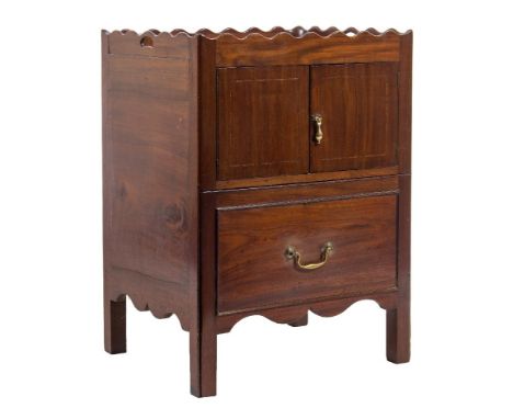 A George III mahogany and later adapted trap top commode:, the shaped top with carrying handles, enclosed by a pair of doors 