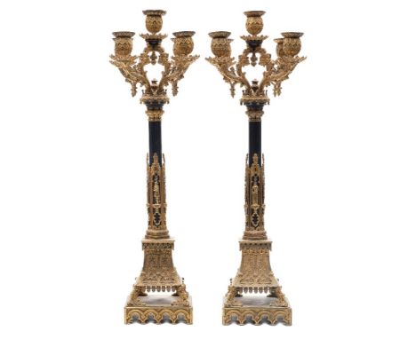 A pair of Willian IV patinated gilt-metal five-light candelabra: of neo-gothic form in the manner of A.W.N.Pugin, cast and ap
