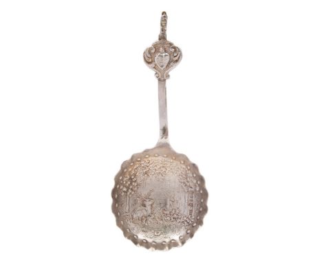 A 19th century Continental silver caddy spoon,  bears import marks for London 1894: the bowl with embossed decoration of a st