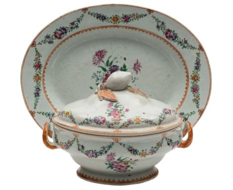 A Chinese export famille rose tureen, cover and stand: of oval form with loop handles and peach finial, painted with floral s
