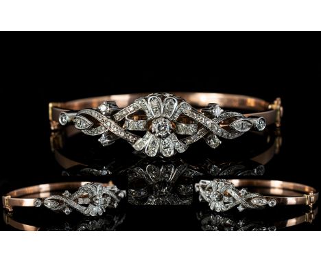 Antique Style 9ct Rose Gold Hinged Bangle Set with diamonds of excellent sparkle, the round brilliant cut diamonds of excelle