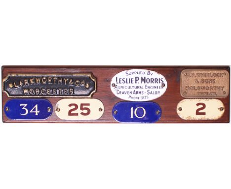 A board with 3 Agricultural plates attached and 4 enamel Number plates attached, two of which appear to be GPO. The agricultu