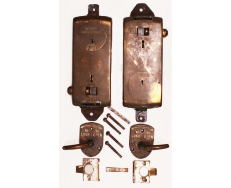 A pair of brass Toilet Door Locks complete with separate handles and strike plates but no keys. Stamped MINI PATENT and manuf
