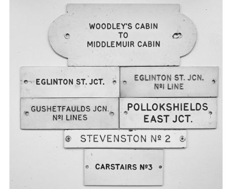 Traffolite Signal Box Shelf Plates, quantity 7 comprising: Woodley's Cabin to Middlemuir Cabin, possibly a train staff label;