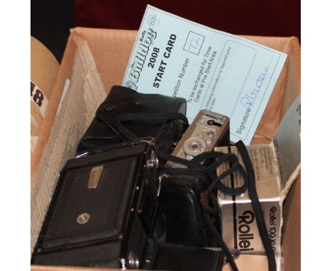 		A Rollei 35 compact camera and others