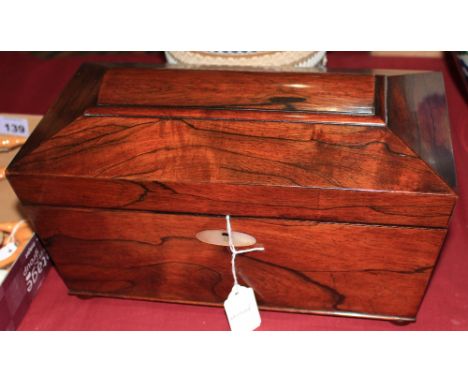 		A Regency rosewood sarcophagus tea caddy. 12 ¾' wide (interior vacant)