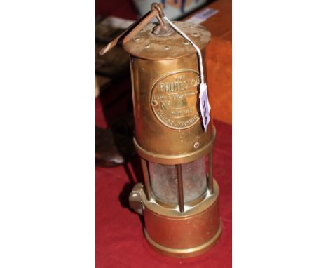 		A brass Protector miner's safety lamp