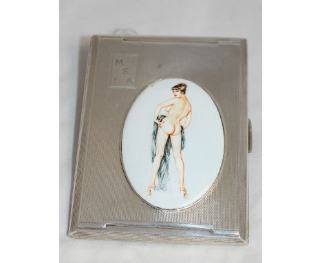 		A silver engine turned cigarette case, the lid with applied oval enamel vignette of a nude lady. 4 ½' high. Birmingham 1921