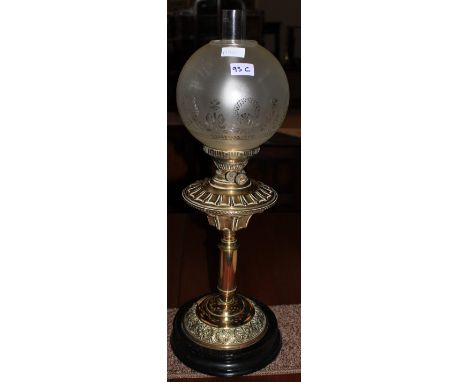 		A brass oil lamp, 19th Century. 27 high A brass oil lamp