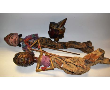 Tribal Art - a pair of hand carved and painted puppets, c.1950, fabric and painted clothing, stick actuators