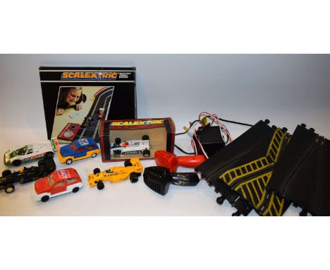 A Scalextric car racing set, track, lap counter, cars, fencing, some boxed