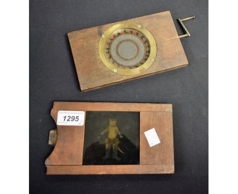 A Victorian mechanical magic lantern slide with turning handle, central motto Good Night, kaleidoscope outer edge; another, d